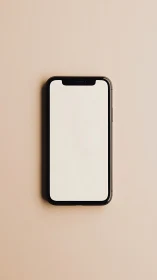 Black smartphone with blank white screen on beige background.