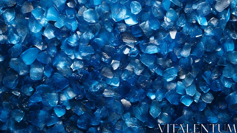 Close view of scattered glossy blue glass crystal chips.