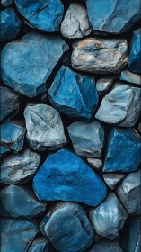 Calm blue river stones rest together in a textured mosaic