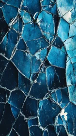 Shimmering cracked blue surface catches light in gentle waves