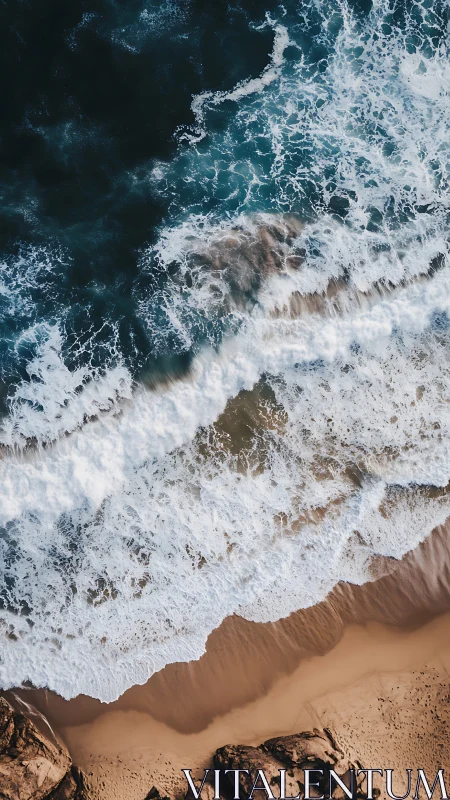 Waves crash against golden shoreline in aerial seascape.