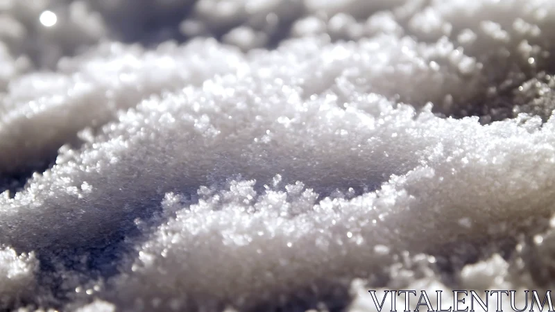 Close-up surface view of granular white snow crystals.
