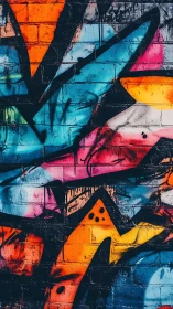 Vibrant angular graffiti on brick wall in urban abstract style.