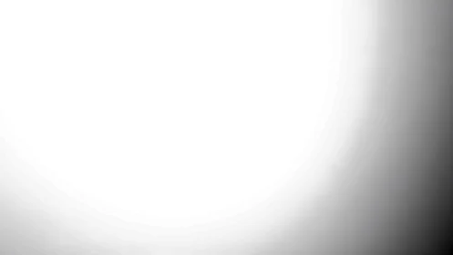 Soft glowing gradient eases from bright white into gentle gray