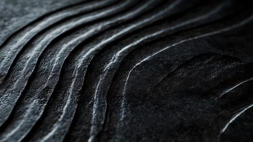 Textured dark stone ridges under directional side lighting.