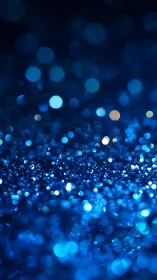 Deep blue bokeh field glows with shimmering light orbs.