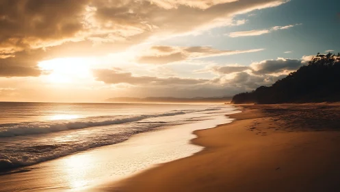 Golden evening waves roll gently along a quiet sandy shore