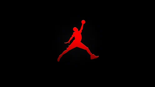 Iconic red jumping basketball silhouette on black field.