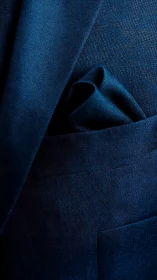 Dark blue fabric pocket with triangular fold detail.