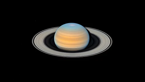 Saturn is shown with concentric rings against black space