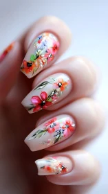 Floral nail art with hand-painted botanical designs on glossy acrylic nails