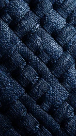 Interlaced navy textile macro reveals woven satin structure