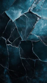 Shattered teal glass forms a dramatic, high-contrast backdrop