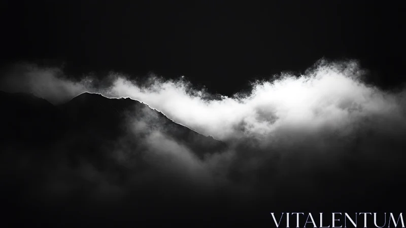 Quiet mountain ridge glows softly through drifting clouds