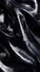 Shimmering silver waves on inky black abstract fabric glow.