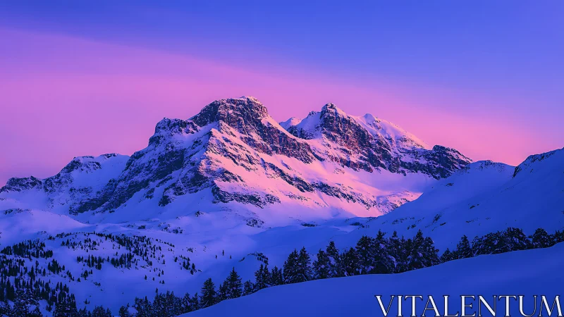 Snow-covered mountain range under vivid pink twilight sky