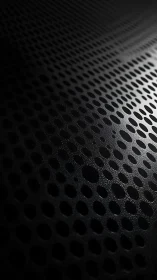 Velvet void of perforated metal breathing quiet light.