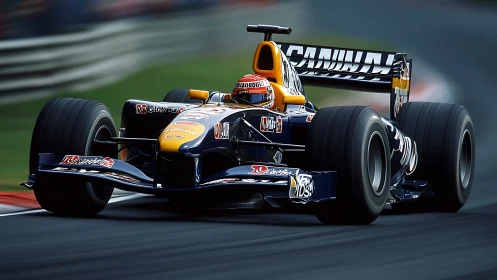 Formula racing car on circuit corner under motion blur.