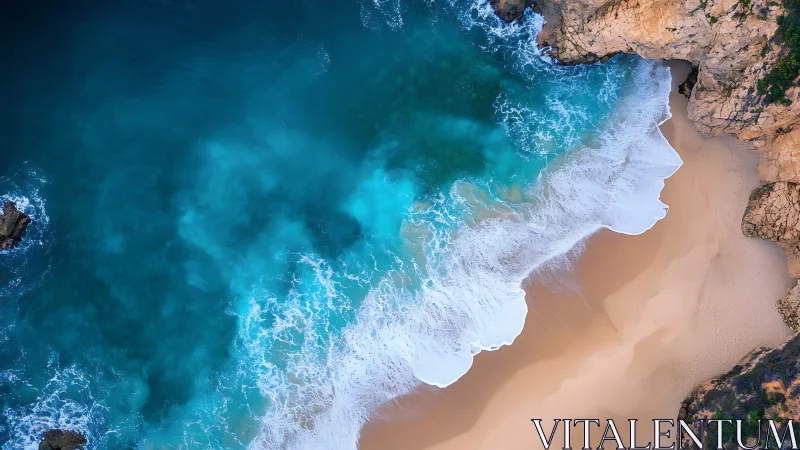 Aerial wave dynamics intersect with eroded sandstone coastal cove