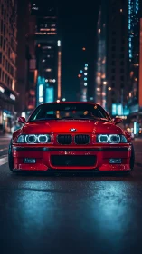 Bold red city cruiser glowing under moody night lights.