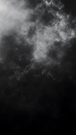 Silver vapor cloud drifts across deep black void.