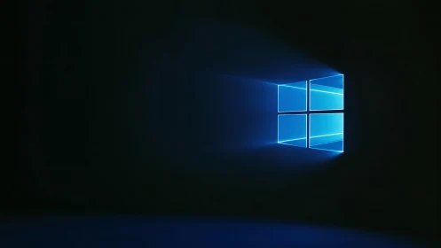 Luminous blue window logo projects volumetric light into darkness