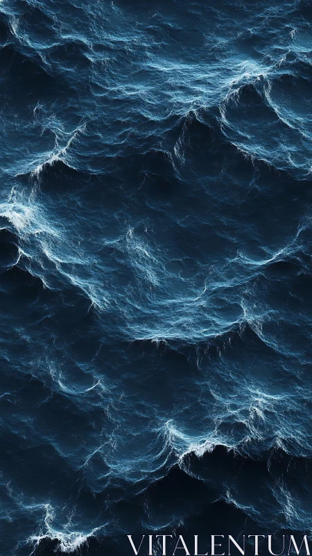 Detailed overhead view of deep blue ocean surface waves.