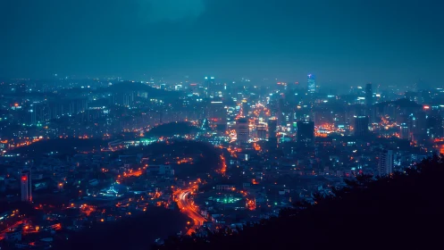 Neon lit city skyline at night under deep blue haze.