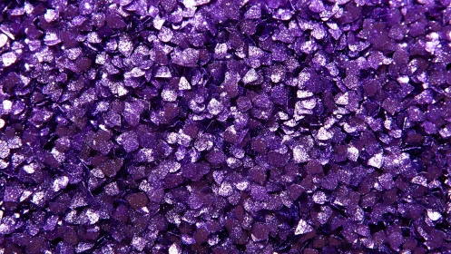 Shimmering violet sugar crystals stage a glittering riot