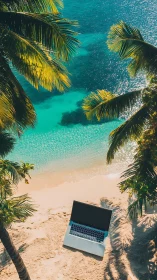 Laptop on tropical beach with turquoise ocean and palm fronds.