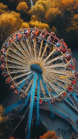 Overhead view of rotating amusement park wheel ride.