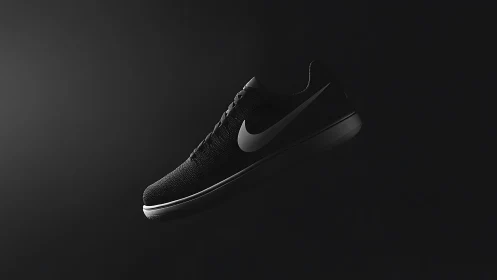 Monochrome athletic sneaker isolated in low key lateral studio lighting