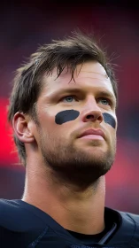 Focused football player gazing ahead with calm confidence.