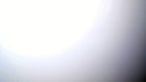 Soft gradient light fade with white overexposed center.