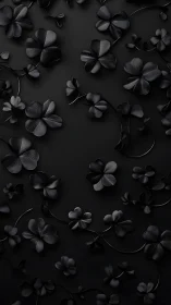 Monochromatic flowers scattered across dark surface.