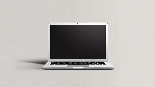 Minimalist silver laptop centered on soft gray background.