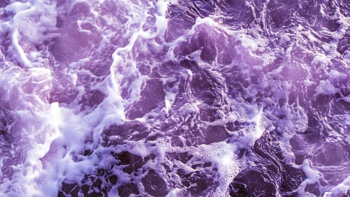 Lavender sea foam dancing across softly glowing waves.
