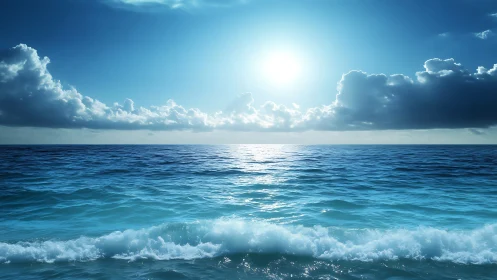 Sunlit ocean horizon under glowing blue sky and clouds.