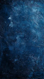 Dark blue textured surface exhibits dense rough patterns