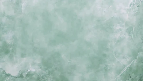 Mint-green mineral surface with diffuse veining topology.