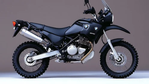BMW dual-sport motorcycle studio profile on neutral background.