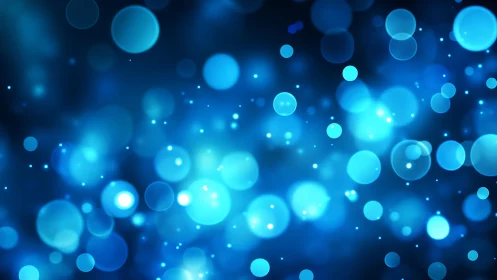 Glowing Blue Bokeh Light Abstract Digital Background Design.
