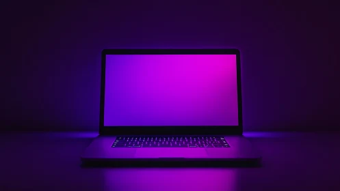 Glowing purple laptop casting a calm creative workspace mood.