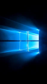 Luminous blue window logo casting rays in dark space.