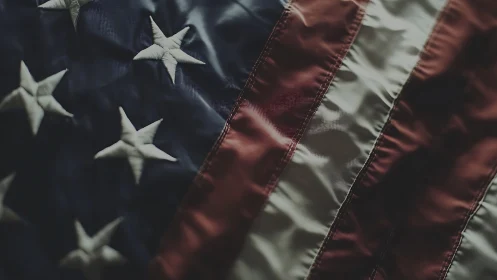 Close view shows stitched stars and stripes on fabric flag