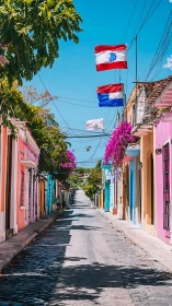 Color-drenched street drifts beneath flags and bougainvillea