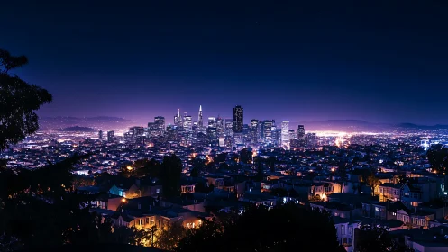 Midnight city glow stretching softly toward the hills.