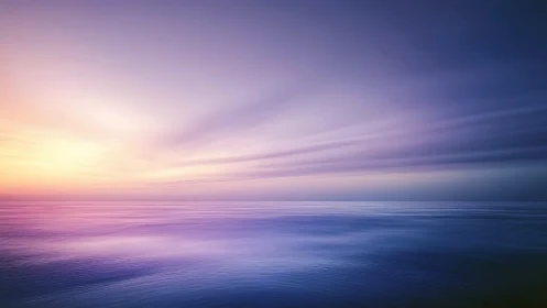 Sunset sky casts soft purple and pink light over calm sea