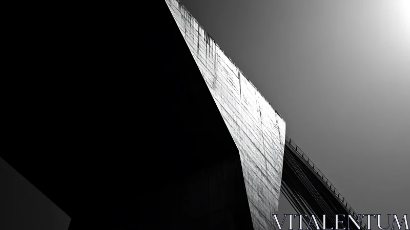Brutalist bridge pylon in stark monochrome sunlight.