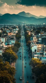 Sunlit mountain city avenue stretches toward hazy peaks.